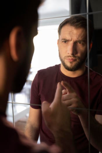 side view anxious man looking mirror side view anxious man looking mirror
